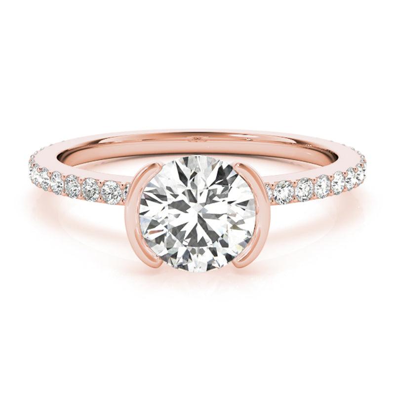 Riley rose gold half rub-over ring, top view showing the open sides of the setting