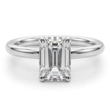 Skye front view - Emerald Cut Diamond solitaire ring with round claws. On a white gold or platinum band. 