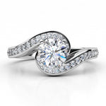 Unique halo wraps the centre round diamond engagement ring. Tempest, created in platinum. 