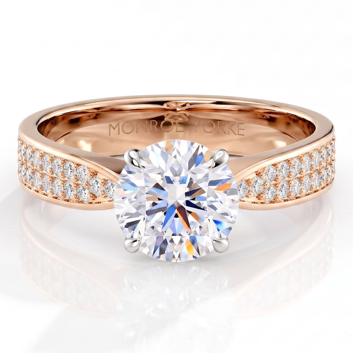 Sophia - Rose gold engagement ring with a round brilliant centre diamond in a four claw setting and pavé diamonds along the band.