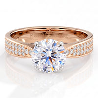 Sophia - Rose gold engagement ring with a round brilliant centre diamond in a four claw setting and pavé diamonds along the band.