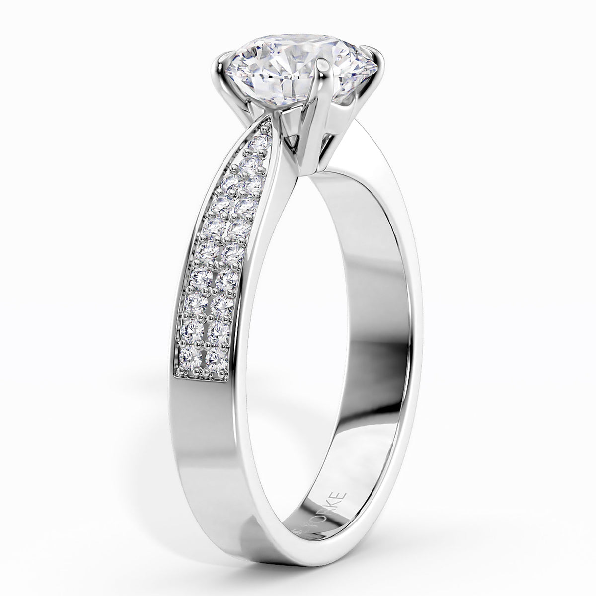 Sophia - White gold or platinum  diamond engagement ring with a round-cut center stone and a pavé-set diamond accent along the band, shown on a clean white background.