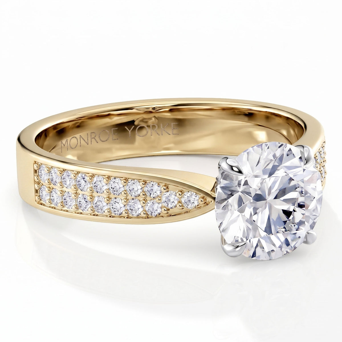 Sophia - A yellow gold solitaire diamond engagement ring with a round brilliant-cut center stone and pavé-set diamonds along the band, shown on a clean white background. 