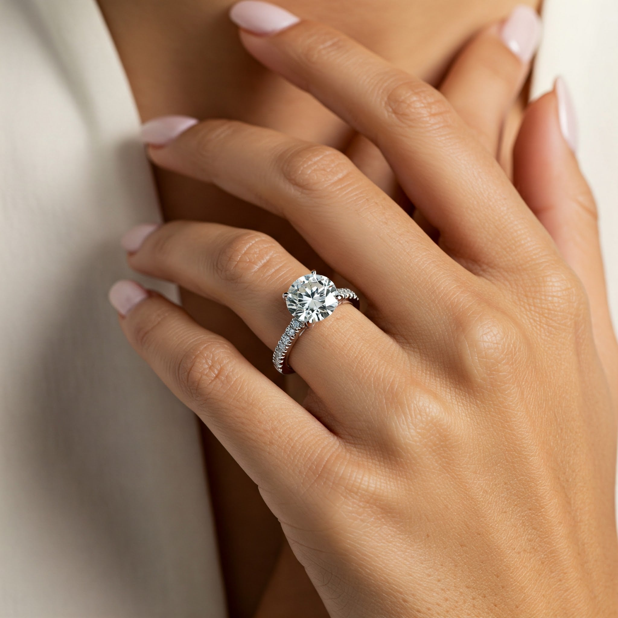 Spring - Centre 1.50 carat round brilliant cut lab grown diamond engagement ring with diamonds on the band. 