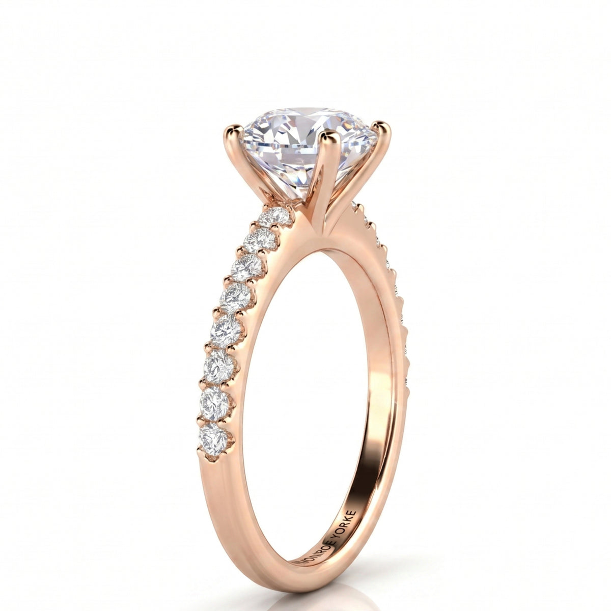 A rose gold engagement ring featuring a large round brilliant-cut diamond center 