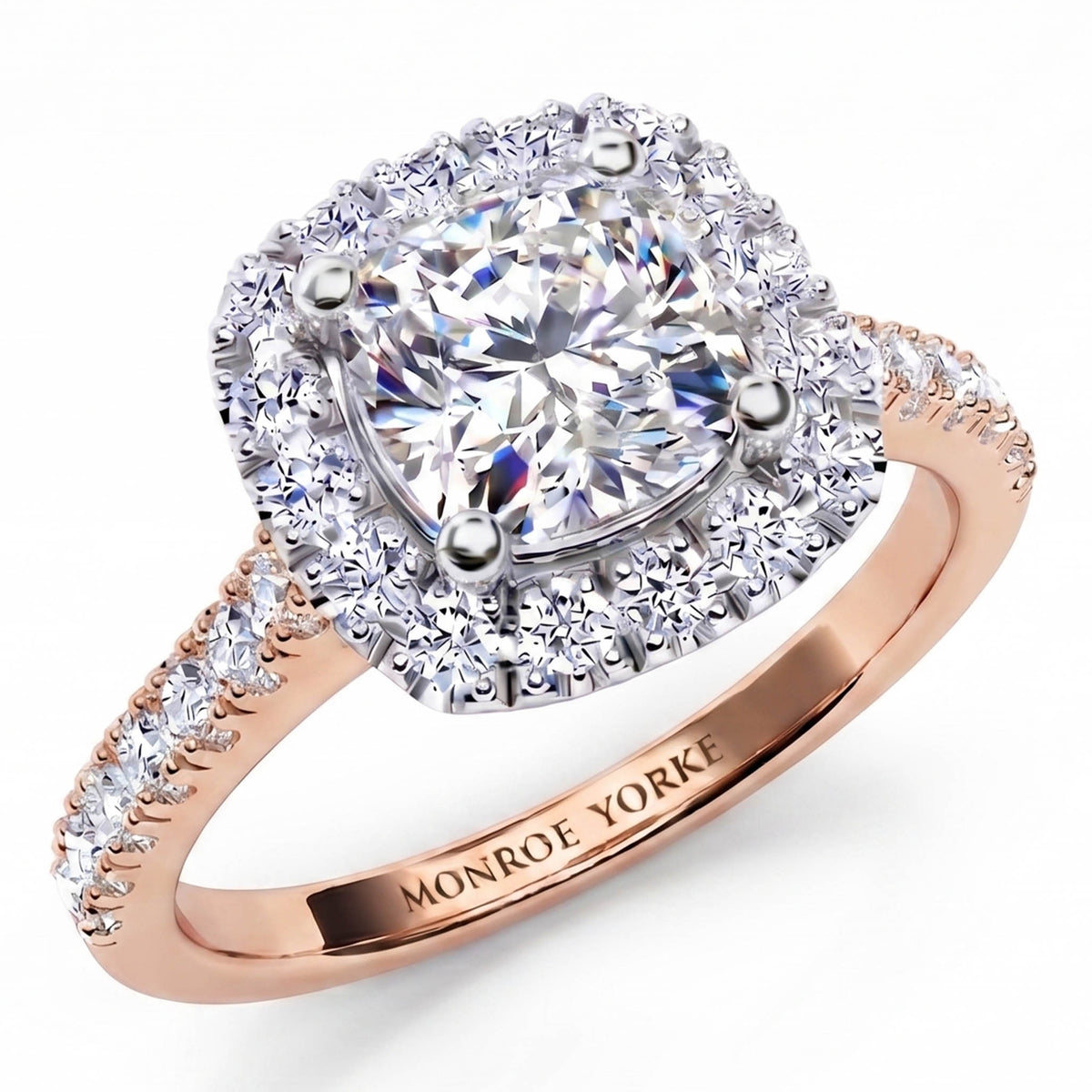 Summer - diamond engagement ring with a cushion cut diamond surround by a halo of diamonds.  Plus diamonds on the band. Rose Gold 