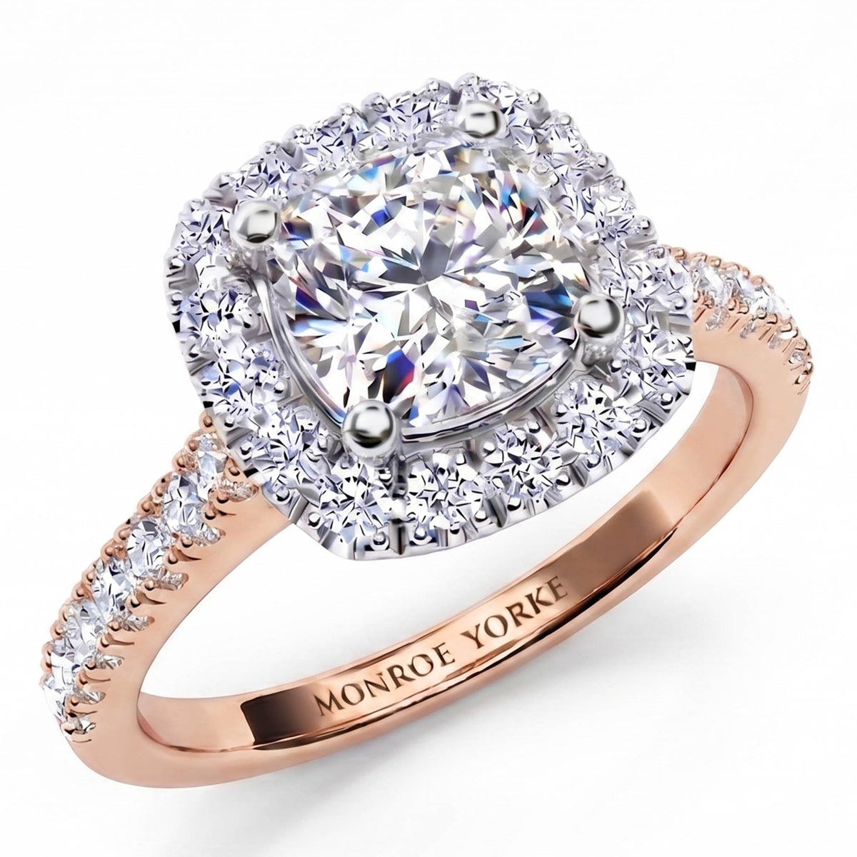 Summer - diamond engagement ring with a cushion cut diamond surrounded by a halo of diamonds. Plus diamonds on the band. Rose Gold