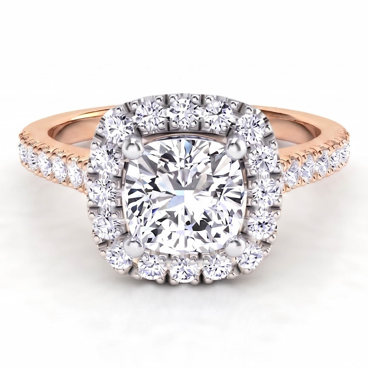 Summer Rose Gold - diamond engagement ring with a cushion cut diamond surrounded by a halo of diamonds. Plus diamonds on the band.