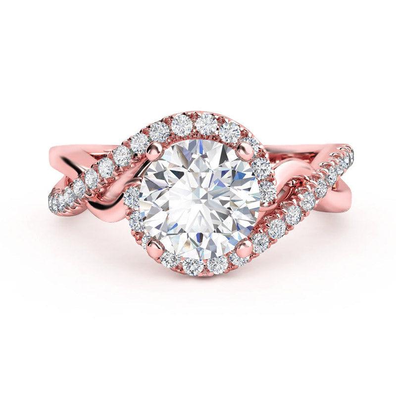 Tessa halo engagement ring in rose gold, showing the braided band splitting into two diamond set strands beneath the halo