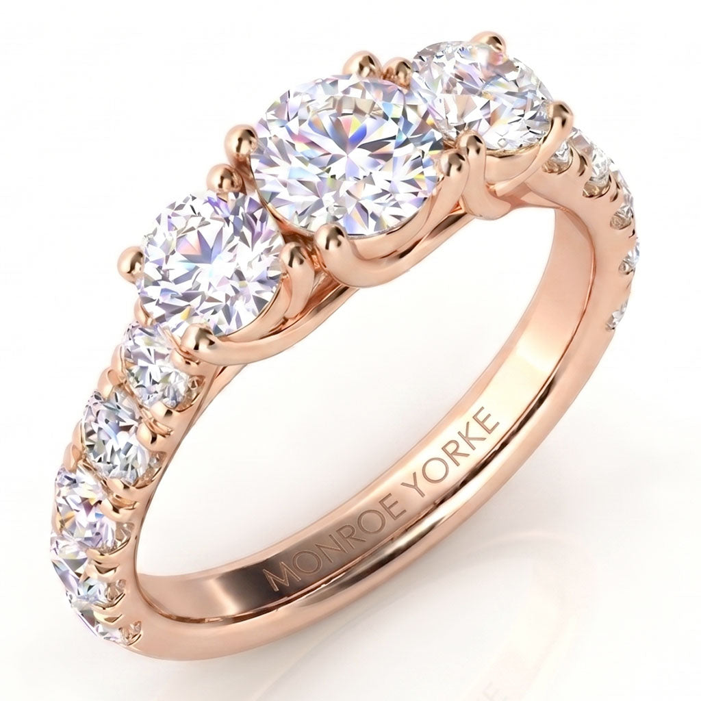 Zuri beautiful three diamond ring with large diamonds on the band. Rose Gold