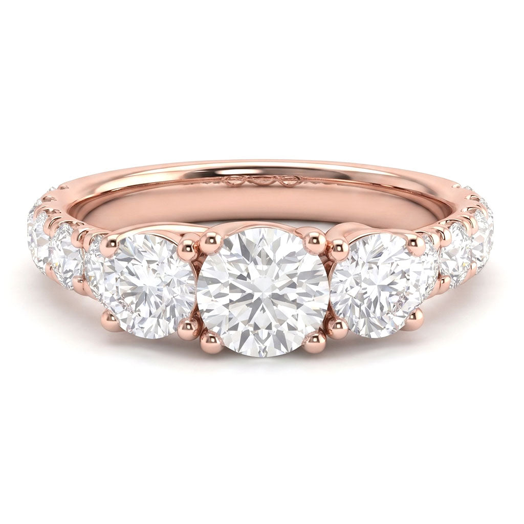 Beautiful trilogy diamond ring with large diamonds on the band. Rose Gold