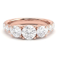 Beautiful trilogy diamond ring with large diamonds on the band. Rose Gold