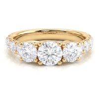A yellow gold three-stone diamond ring 