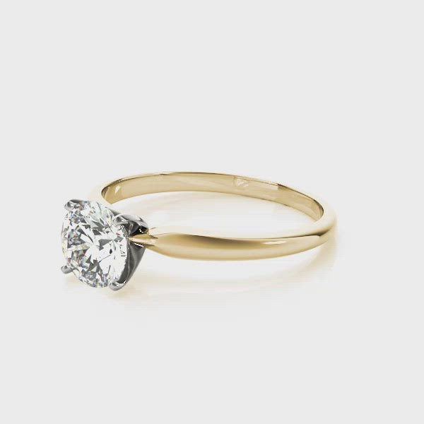 Our Promise solitaire engagement ring is classic and beautiful. The highly polished yellow gold band stylishly holds the round brilliant cut diamond aloft. Nothing more and nothing less than pure excellence.