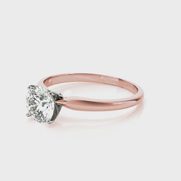 Our Promise solitaire diamond engagement ring is classic and beautiful. The highly polished rose gold band elegantly holds the round brilliant cut diamond aloft. Nothing more and nothing less than pure perfection.
