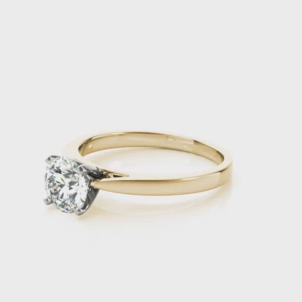 An elegant solitaire diamond ring in rich yellow gold is the perfect choice for your perfect choice. The GIA certified round brilliant cut stone is set in a four claw setting. An undeniable addition to your proposal.