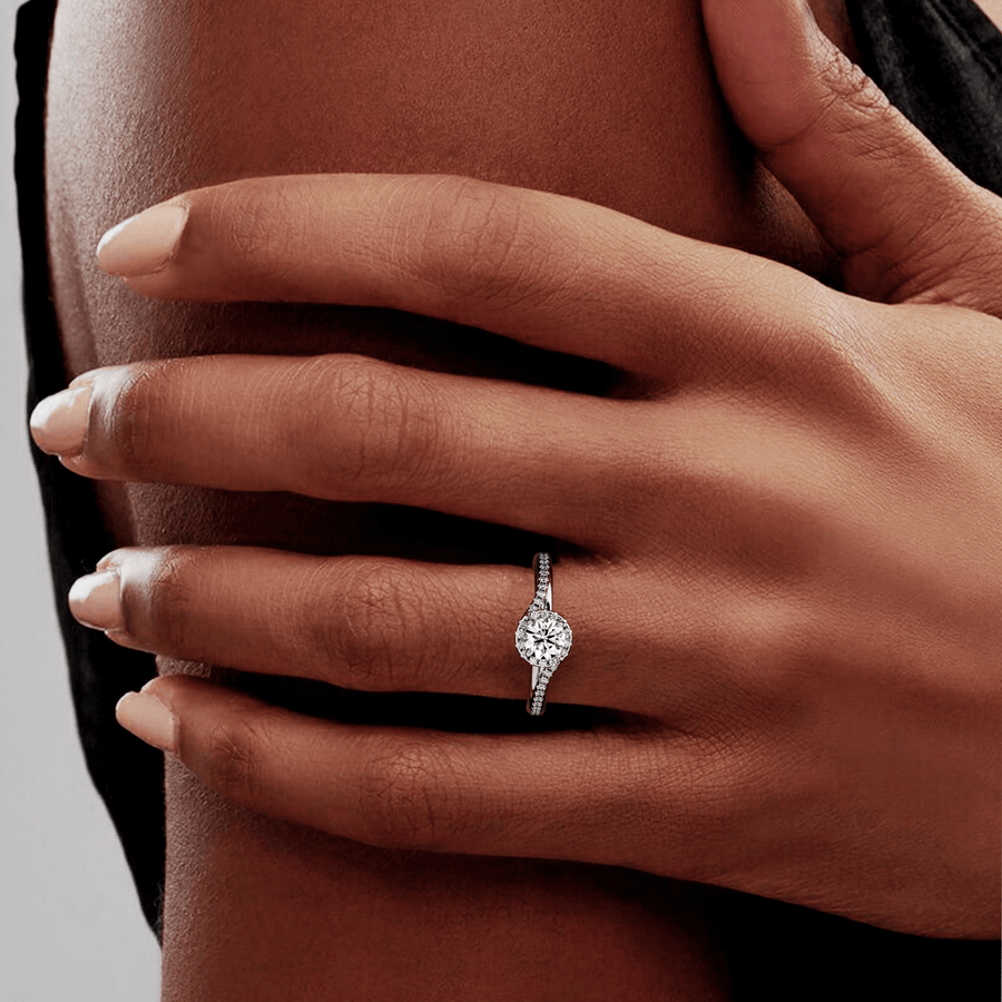 Stunning unique halo diamond engagement ring on hand
