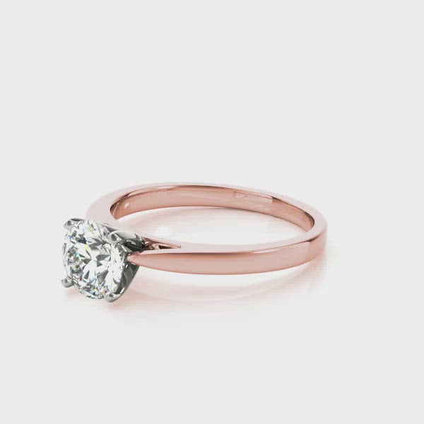 Solitaire diamond engagement ring in rich rose gold is the perfect choice for your perfect choice. The GIA certified brilliant round cut stone is set in four prongs. An undeniable addition to your proposal.   