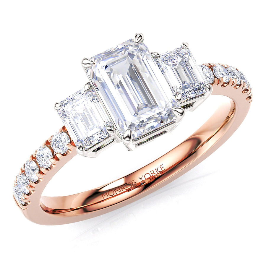 Aspen - Emerald cut three diamond engagement ring. Diamond set band in rose gold. 