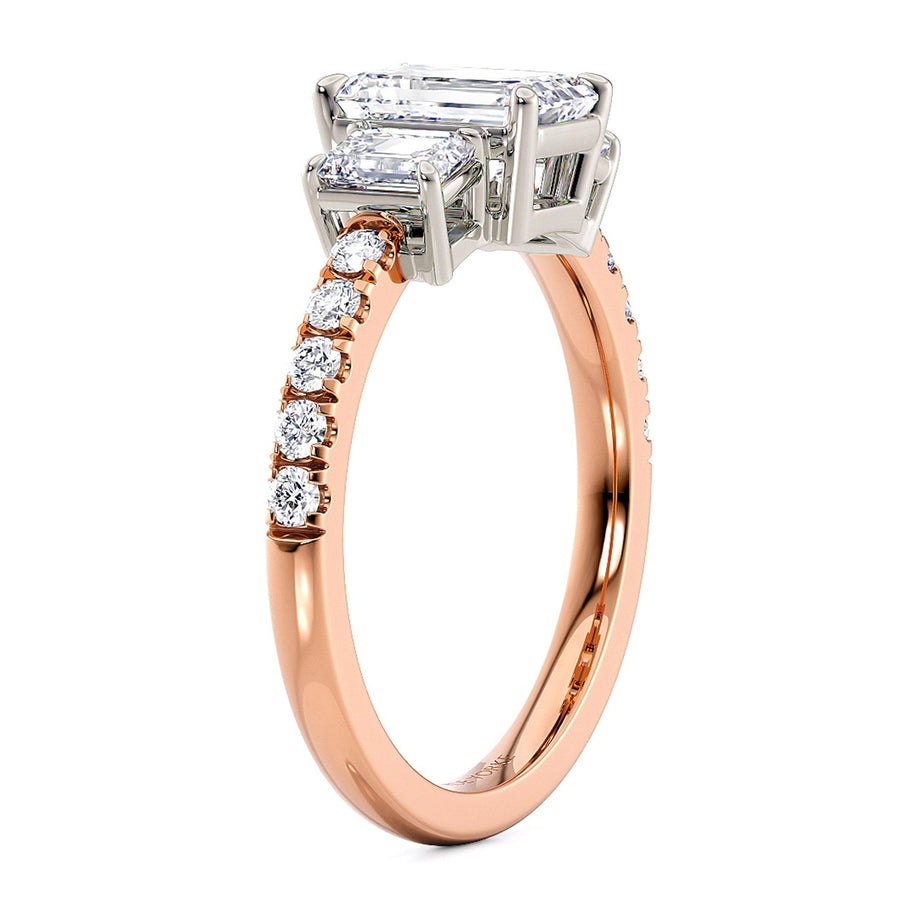 Aspen three diamond engagement ring.  Centre three emerald cut diamonds in a white gold setting and diamond set band in rose gold. 