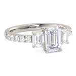 Emerald cut diamond three stone ring.  Emerald cut trilogy ring by Monroe Yorke Diamonds.  18ct White Gold. 