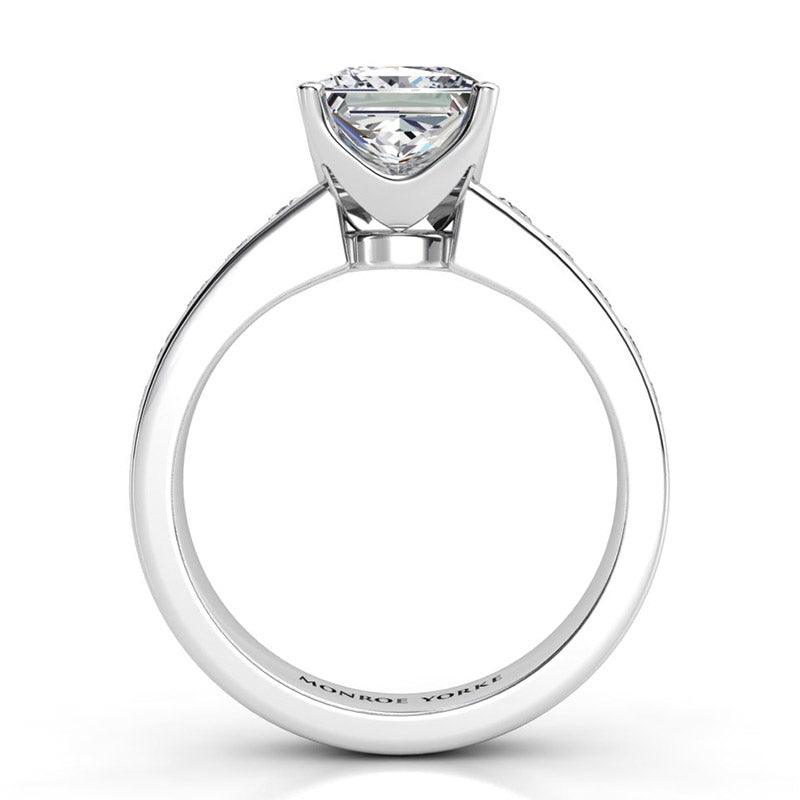 Albany White Gold.  Side view 3. princess cut diamond centre in a beautiful basket setting.  — view 5