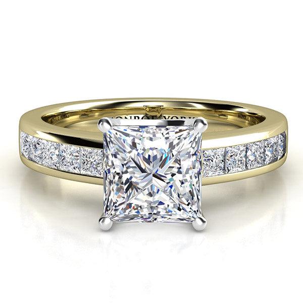 Gold princess cut diamond engagement ring. Gold band with channel set princess cut diamonds.