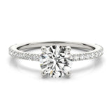 April - Round diamond ring with diamonds down the band. White gold or platinum. 