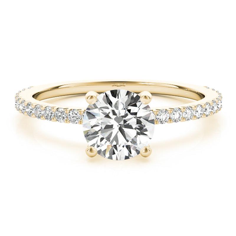April Gold Round Diamond Engagement Ring. 4 claw centre setting. Diamonds on the band. 