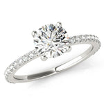April - Round diamond ring with diamonds down the band. White gold or platinum. 