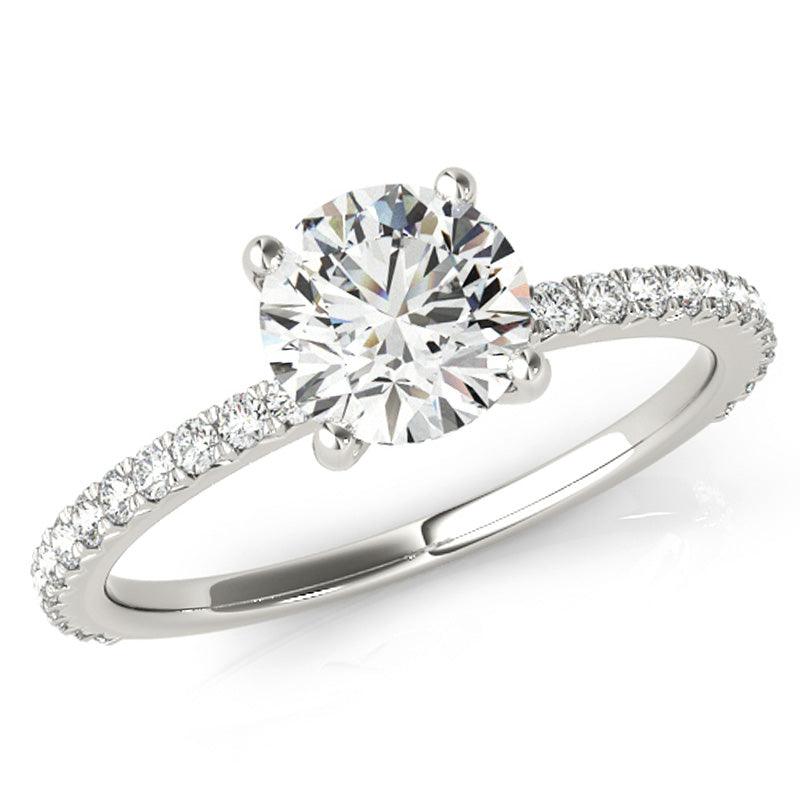 April - Round diamond ring with diamonds down the band. White gold or platinum. 