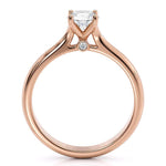 Asti - Rose gold solitaire diamond engagement ring. 4 claw setting. two diamonds set at the base of the centre setting.  Side view 2
