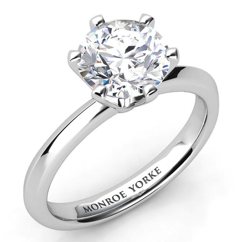 Calais in Platinum.  Six claw solitaire diamond engagement ring.  Knife edge band. 
