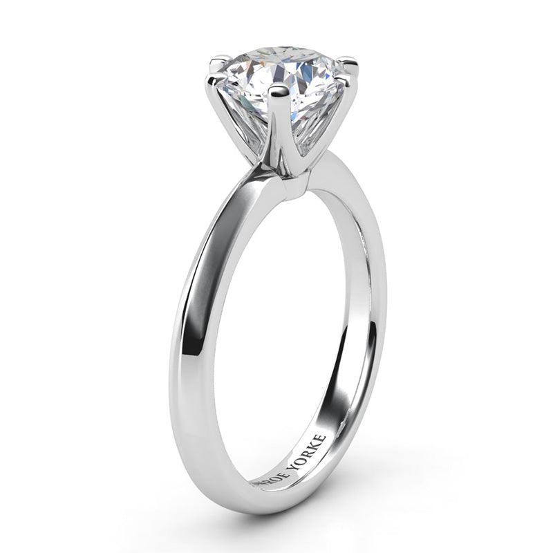 Calais - Side view. Six claw solitaire diamond engagement ring. Knife edge band. 18ct White gold. 