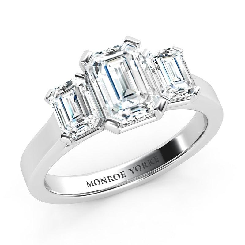 Calista Platinum - Emerald cut diamond trilogy ring.  GIA certified
