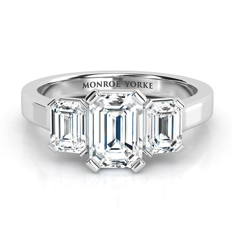 Calista Platinum.  Emerald cut three stone ring, three diamond ring 