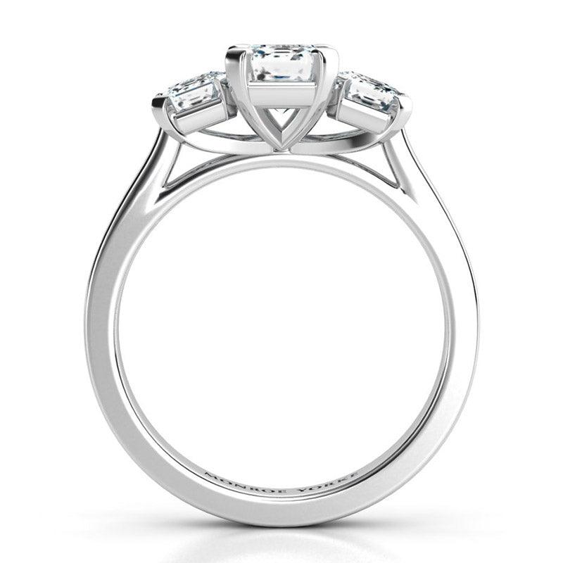 Calista Platinum - emerald cut three stone ring.  Side view  showing the centre setting
