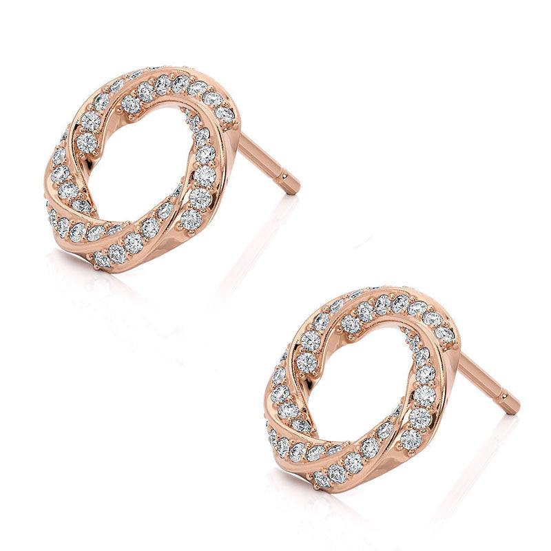 amila - rose gold diamond earrings. Diamonds pave set into a spiral pattern.  side view