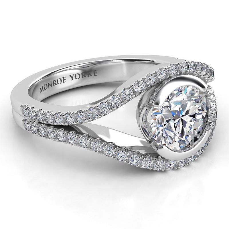 Capri - unique diamond engagement ring with round diamonds. White gold. Side view showing the beautiful details of this ring. 