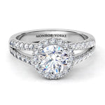Ceduna created in platinum.  Front view. Diamond ring with a centre round diamond surrounded by a halo of diamonds and diamonds set split band. 