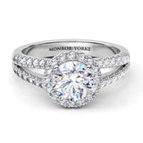Ceduna created in platinum.  Front view. Diamond ring with a centre round diamond surrounded by a halo of diamonds and diamonds set split band. 