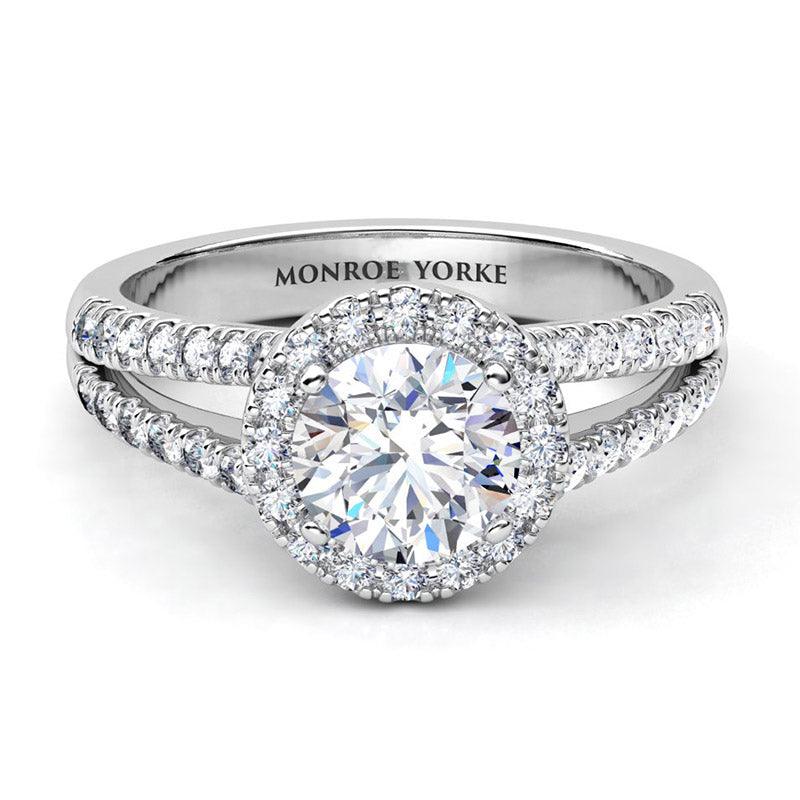 Ceduna created in platinum.  Front view. Diamond ring with a centre round diamond surrounded by a halo of diamonds and diamonds set split band. 