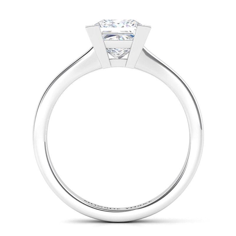 Princess cut solitaire diamond ring.  Chester in platinum. Side view showing beautiful centre setting.  