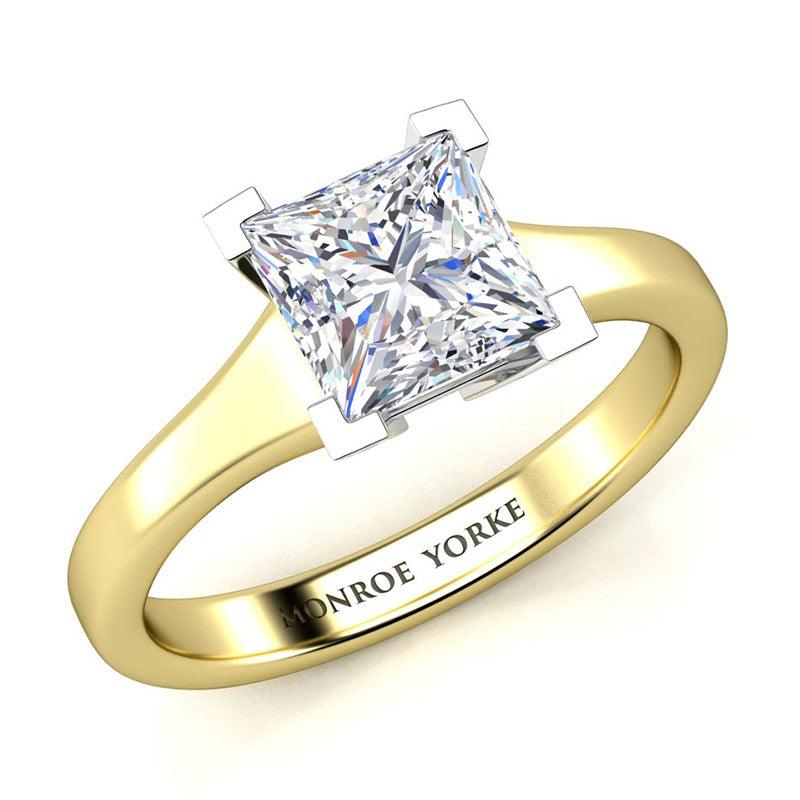 Princess cut diamond solitaire ring.  Yellow gold band and white gold centre setting.  Chester