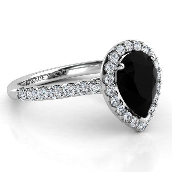 Black pear diamond halo ring with side diamonds. White gold 