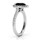 Ciara Platinum - pear halo black diamond  side view showing the beauty of the centre setting and diamonds down the sweep up band. 