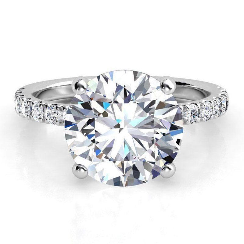 Clover - 4 claw, round diamond engagement ring. White gold 
