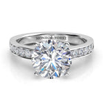 Danae - Round Brilliant Cut Diamond Engagement ring with side diamonds. 4 claw centre setting. Top view. 18ct White Gold.