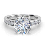 Danae - Platinum Round diamond ring in a 4 claw setting with pave set diamonds on the sweep up band. Front view. 
