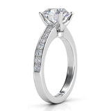 Danae - Round diamond ring in a 4 claw setting. Platinum diamond ring. Side view, showing pave set diamonds on the band and the beautiful centre setting.